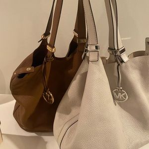 Two MICHEAL KORS leather Hobos. Selling together. See pics.